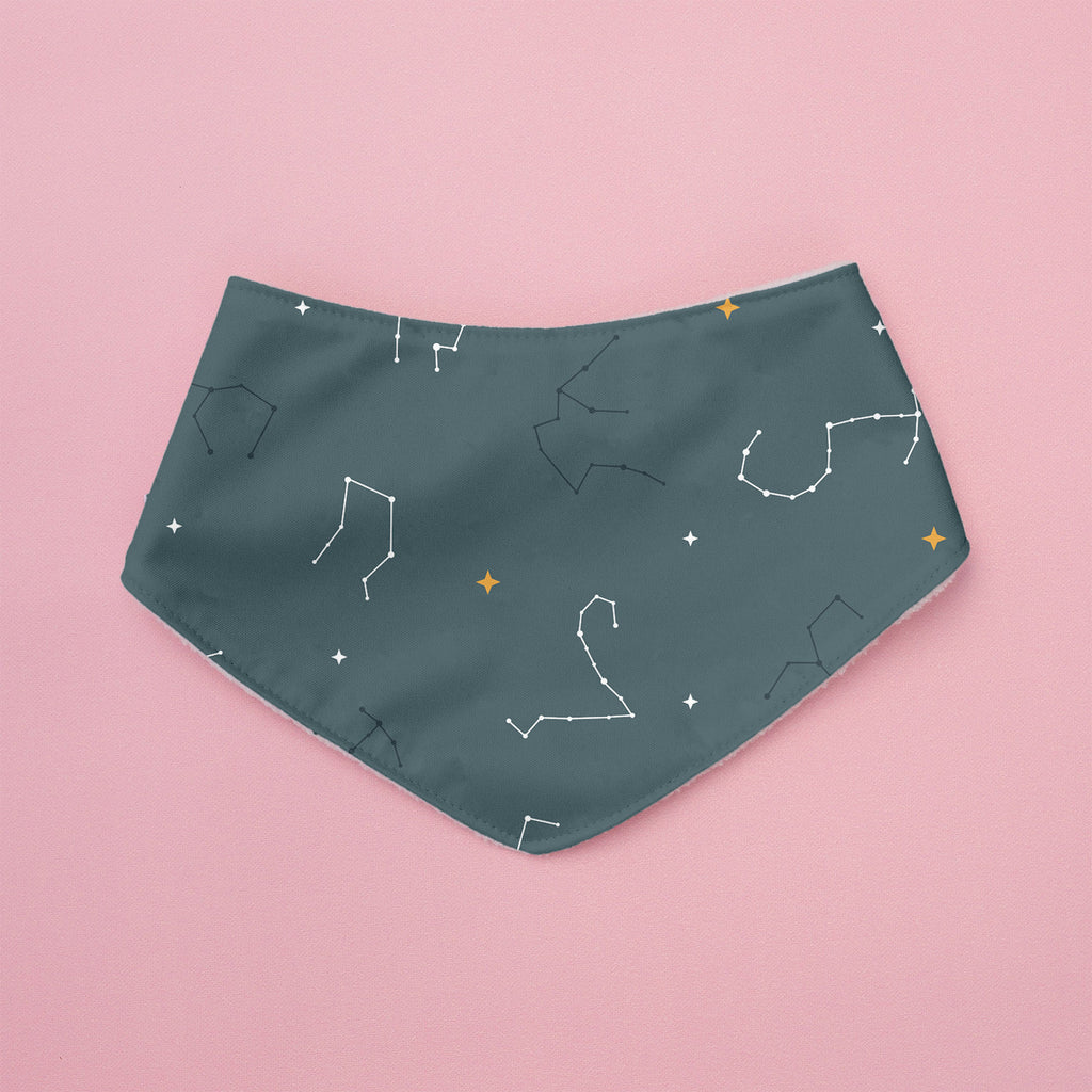 Teal bandana with star and constellation pattern on a pink background