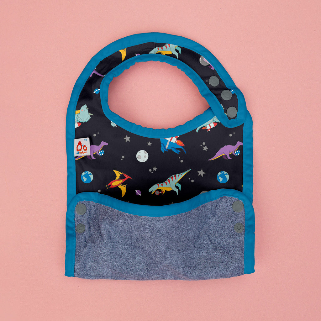 Children's bag with dinosaur and space design on a pink background