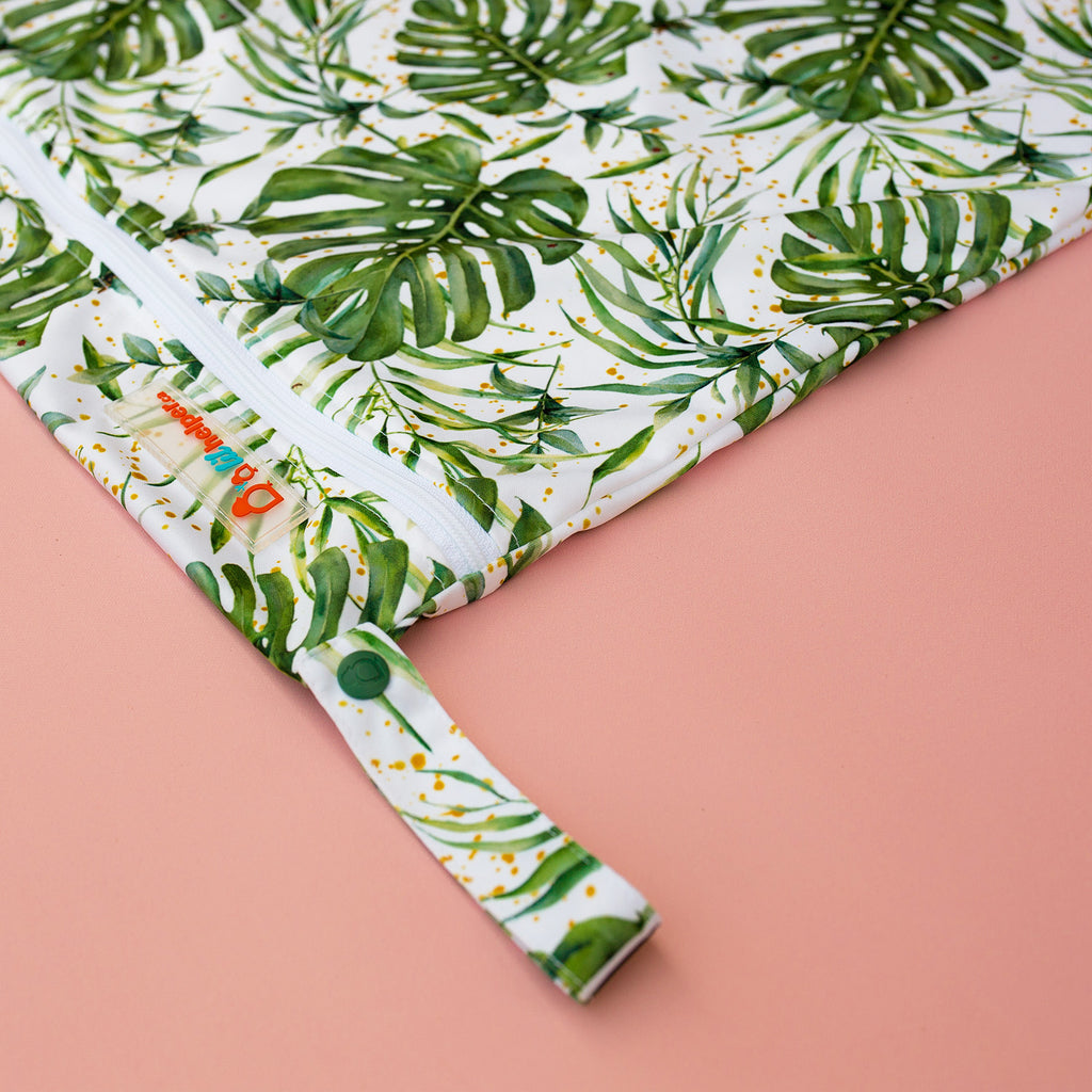 Bag with tropical leaf pattern on a pink background