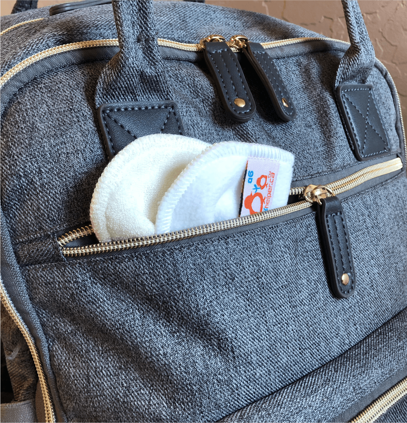 cloth wipes peaking out of a diaper bag